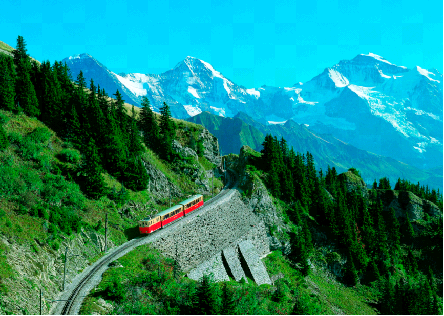 Train passing through mountains in Switzerland